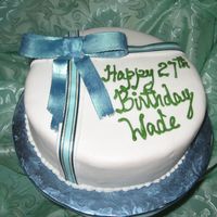 Img_1909_3.jpg This is a Jamaican Fruit Cake covered with fondant and decorated with a gumpaste bow and satin ribbon.