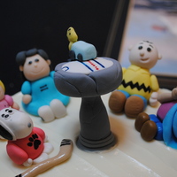 Charlie Brown Cake Birthday cake for my boyfriend. Snoopy is a hockey player, and woodstock is driving the zamboni on the birdbath ice rink.