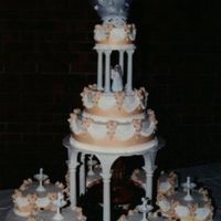 Surrounded By Hearts The unique thing of this cake is the way it is iced. From an old Celebrate Wilton book, the design uses waxed paper scallops that are...