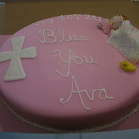 Baby Girl Baptism Cake 2 layer vanilla bean cake with fresh strawberry filling, covered in buttercream and fondant. Gumpaste cross, baby, toys, and baby blanket...