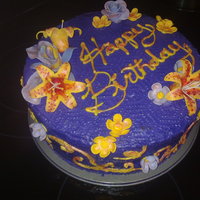 Colourful Birthday Cake Chocolate cake with purple icing and various gum paste flowers