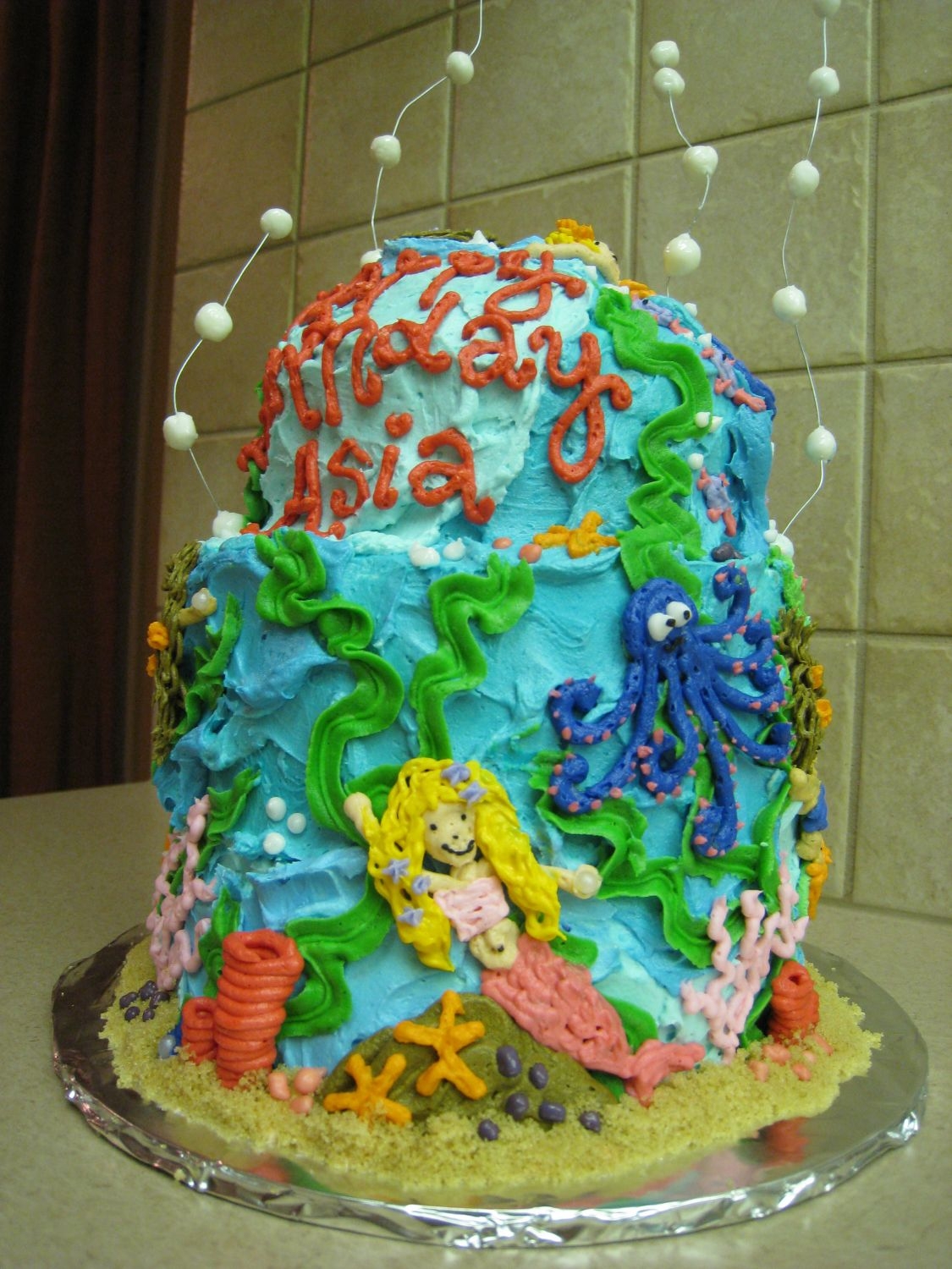 Mermaid Cake mostly buttercream...white and yellow are royal. lots of fun to do this cake!