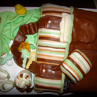 Diaper Bag Baby Shower Cake Replica of the diaper bag of the mom to be with some important accessories.Gum paste shoes, duck, keys, and bottle.