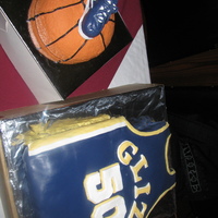 Basketball And Jersey Cake basketball shoe on top of a half basketball, basketball jersey cake for a friend's 50th birthday