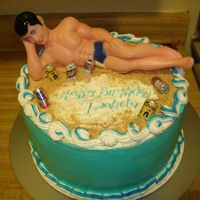 Guy On Beach This one was fun to do. Yellow cake with fresh strawberries and whipped cream filling. Icing is buttercream.