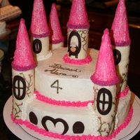 Princess Castle Cake My daughter's 4th birthday. This is my 4th cake I have made so far. 12in and 8 inch rounds. Butter cream frosting, royal icing piping...