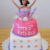 Barbie Cake Both tiers are covered in fondant. Gumpaste details on cake and barbie.