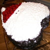 Santa Made out of a heart shaped cake pan, with chocolate cake and cherries