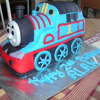 Thomas The Tank Engine Buttercream icing with fondant decorations. Thomas' face is hand made from fondant