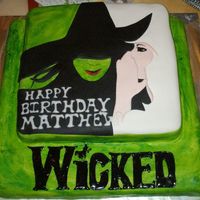 Matt's Wicked Birthday Cake Wicked cake for my son's Wicked themed birthday party. Yellow cake with fondant and royal icing decoration.