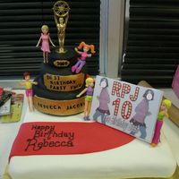 Becca's Movie Star Award Cake Sassy cake based on Warren Brown's recipe covered in rolled fondant decorations with some Polly Pocket dolls and a mini movie poster...