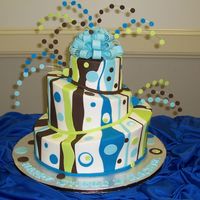 Brown And Blue Whimsy For A 16 Yr Old this was a 6, 10 and 14 inch rounds carved and used SFS. iced in buttercream and fondant accents, 22ga wire with fondant dots and tylose...