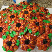 Cupcake Bouquet When I made these I was thinking sunflowers...but they didn't really turn out like sunflowers...more like pretty flowers :)