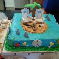 Jimmy Buffet Chocolate cake with strawberry fillingfondant/gumpaste accentsEach side of the cake had different little figures on them to describe a song...