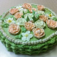Just For Fun Home made butter cake covered and decorated with butter cream icing and Royal icing flowers.