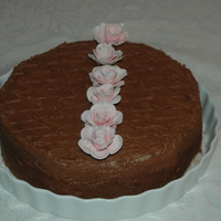 Welcome To Neighbors Home made chocolate cake sandwiched and covered with butter icing made using Australian Cadbury's cocoa powder. Gum Paste roses for...