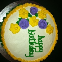 Wilton Second Class (Flowers And Design) Basket weave with royal icing flowers on top.