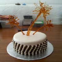 Chocolate Chip Sides With Caramel Fireworks/palm Trees A fondant cake with chocolate chip pattern on sides and caramel fireworks or palm trees mattering on your perspective.