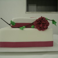 Gumpaste Carnation The bottom is fake and the top was chocolate cake with cocoa-flavored condensed milk filling. The flowers and leaves were gumpaste, and the...