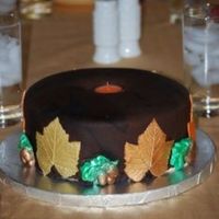 Candle Cake 2 9' butter pecan cakes with cream cheese filling, caramel SMBC, & dark chocolate fondant. 1/2 gum paste 1/2 fondant leaves &...