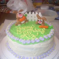 Bunny Carrot Cake This was my first decorated cake. The bunnies and fence were made out of fondant - the rest was cream cheese frosting.