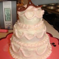 Tiny Tiers This cake is made of 4", 3" and 2" tiers. It is strawberry cream cake with cream cheese frosting, which is why it turned out...