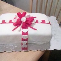 Every Year Is A Gift This cake was made for an 11th anniversary party. It is a white cake filled with strawberries and covered in marshmallow fondant. I also...