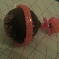 Baby Rattle Cake pop baby rattle. Chocolate fudge cake pop dipped in chocolate. I dipped the pop in edible glitter on top. The strip around the pop and...