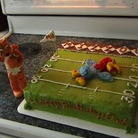 Mu Beats Ku Simple two tiered square cake covered in buttercream with gumpaste KU Jayhawk, Mizzou infield and Truman the tiger