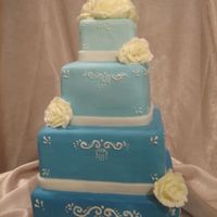 Stacked Blue Squares With Bc Roses covered in fondant with piped accent and bc rosesI had a very last min cake order and thought this cake would be simple enogh to be able to...