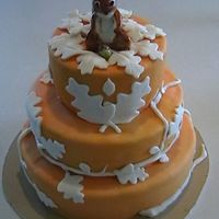 Squirrel Cake My take on the squirrel cake made for a bake sale to benefit my sons school. Three tires covered in pumpkin colored fondant with ashimmery...