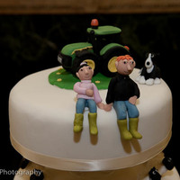 John Deere Tractor Wedding Cake Wedding cake for Roger and Annie - John Deere Tractor on top with cows all around the middle tier and sheep all around the bottom tier