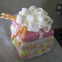 Mini Present Cake. My Partner bought me 5Kgs of Fondant (Gotta love him!), so i had some fun... End up perfect as it was his cousins birthday as well!