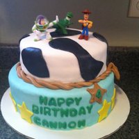 Toy Story This was my first fondant cake I made for my son's 4th Birthday. The bottom tier was vanilla cake, cookies & cream filling, butter...