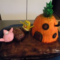 Spongebob Square Pants My first on 2 expierments. First time sculping a cake (pineapple house). First time using the airbrush. Luckily it is only for my daughters...