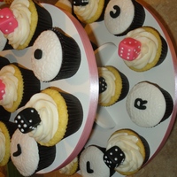Bunco Night Local BUNCO group. Fondant dice in pink and black. Left, Right, Center, on top of embossed white fondant.