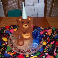 Birthday Bear 3D Bear Pan done for little boy's birthday. Little cake is a cupcake torted to add height. Attached a balloon to the gift bag, but...
