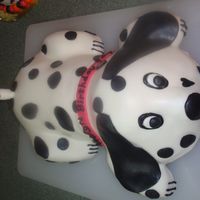 Paige's "pongo" Cake The rear is 1 mix wonder pan, 4 mini loafs pans for legs, carved, (1) 8 inch round cut in half for body and 1 1/2 mix wonder pan for head....