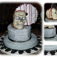 "saw" Cake The skull and saw blade are three seperate pieces of solid white chocolate that were glued together with more white chocolate and shaded...