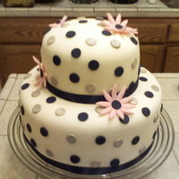 Polka Dot Daisy Cake Bridal shower cake that matches napkins and plates from Target