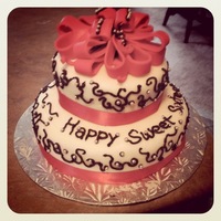 Sweet Sixteen Birthday Cake Cake I made for my cousins 16th birthday. Chocolate fudge with vanilla buttercream. First attempt at a bow.. the black icing on it is to...