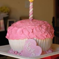 Kate's 1St Birthday Cake 8" round cakes, carved into cupcake shape. Cupcake "paper" is fondant, didn't come out quite like I wanted. Candle,...