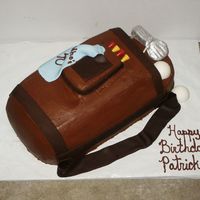 Golf Bag This was actually for a man's 40th Birthday. It was made from a 1/2 sheet cake. Cut to shape. It is covered in Chocolate buttercream...