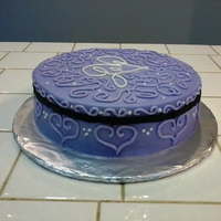 Purple Crazy Swirls Love Cake This was my final cake for the 1st Wiltons basic class. My piping needs work. I was disapointed because by the time I got home it developed...