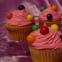 Bubblegum Cupcakes My kids helped me make these for my birthday. Daughter helped mix. Son helped put on gumballs and hubby helped eat!! lol i loved them.