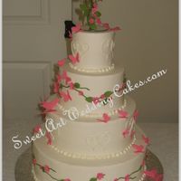 Pink Flowers And Butterflies Buttercream iced, fondant flowers, gumpaste butterflies.