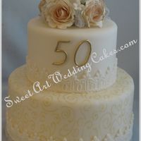 50Th Anniversary Fondant covered with gumpaste roses.