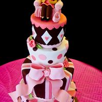 Brown And Pink Baby Shower This was a labor of love..4 tiers, 12-10-8-6, 3 layers each carved. Chocolate cake with chocolate fudge frosting for filling then covered...