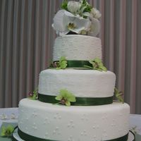Wedding Cake This was my first wedding cake (other than from the Wilton class). I made it for my brother. It's made of fondant and real orchids. It...