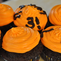 Bright Orange Construction Cupcakes I added orange extract to the frosting recipe and used a double chocolate recipe for the cupcakes themselves. I also used chocolate cookie...